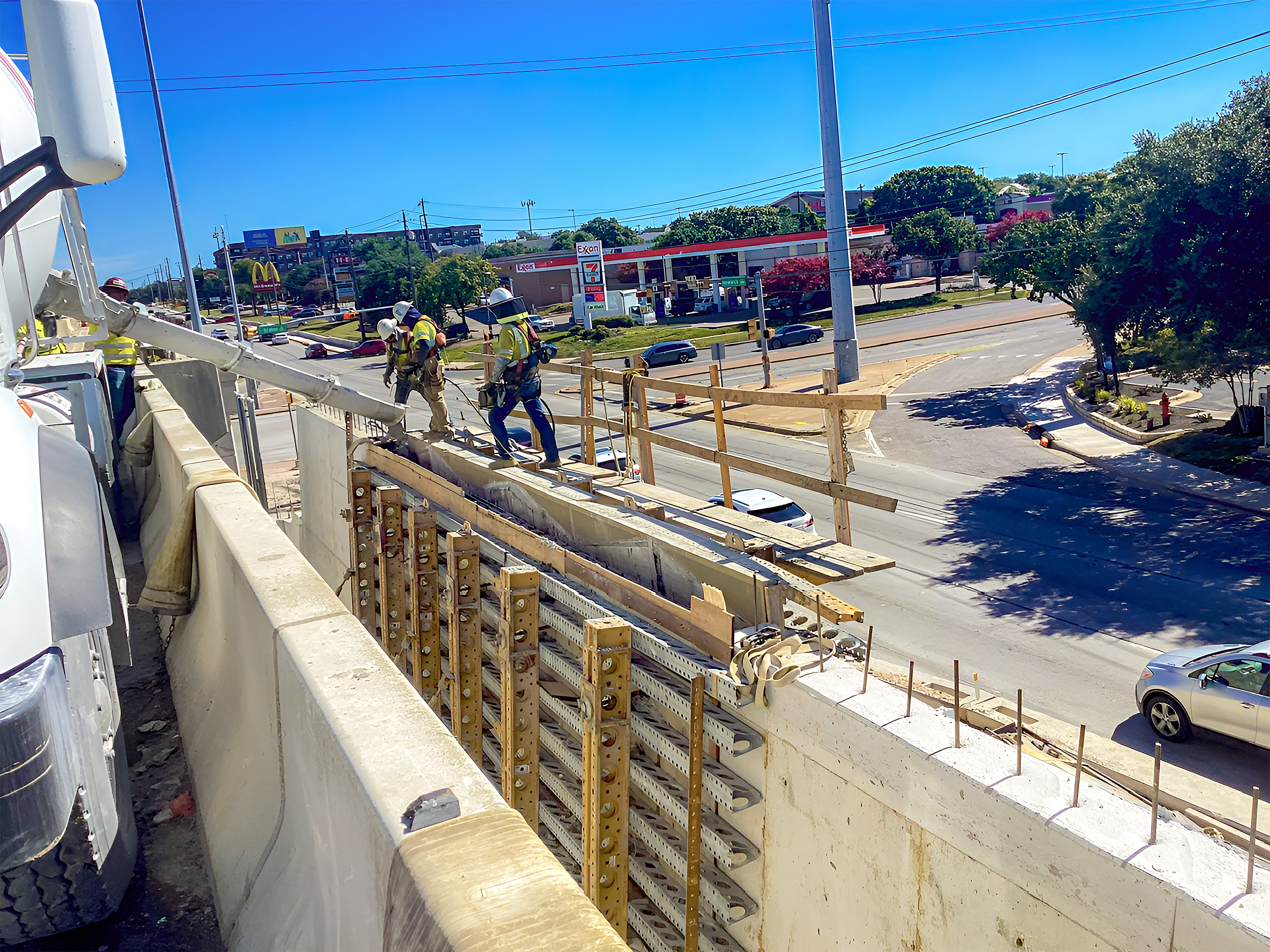 Photo of crews pouring a concrete cast in place near the SB Great Hills intersection